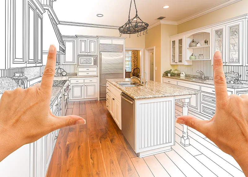 Hands framing a 3D kitchen design and remodeling plan | Carpetland USA Granite & Flooring