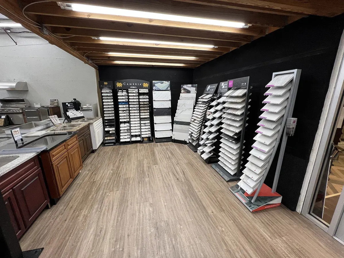 Countertop samples and flooring displays arranged inside the showroom | Carpetland USA Granite & Flooring