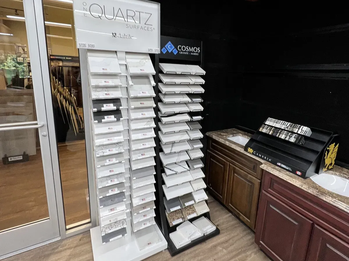 Quartz surface samples and kitchen cabinet displays in the showroom | Carpetland USA Granite & Flooring