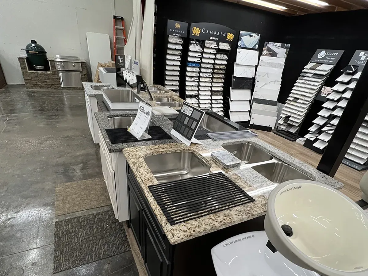 Countertops, sinks, and flooring samples displayed in the showroom | Carpetland USA Granite & Flooring